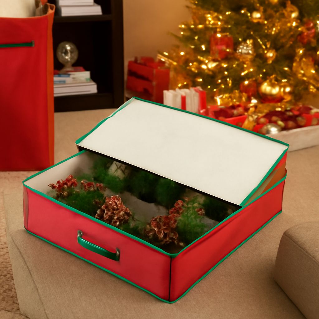 Labeled Christmas storage containers holding ornaments, lights, wreaths, and holiday decor